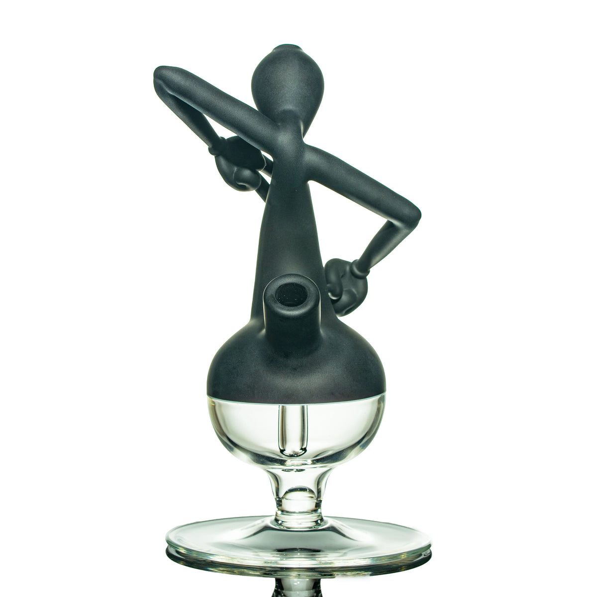 Artistic black and clear glass water pipe with sculpted figure design on a white background.