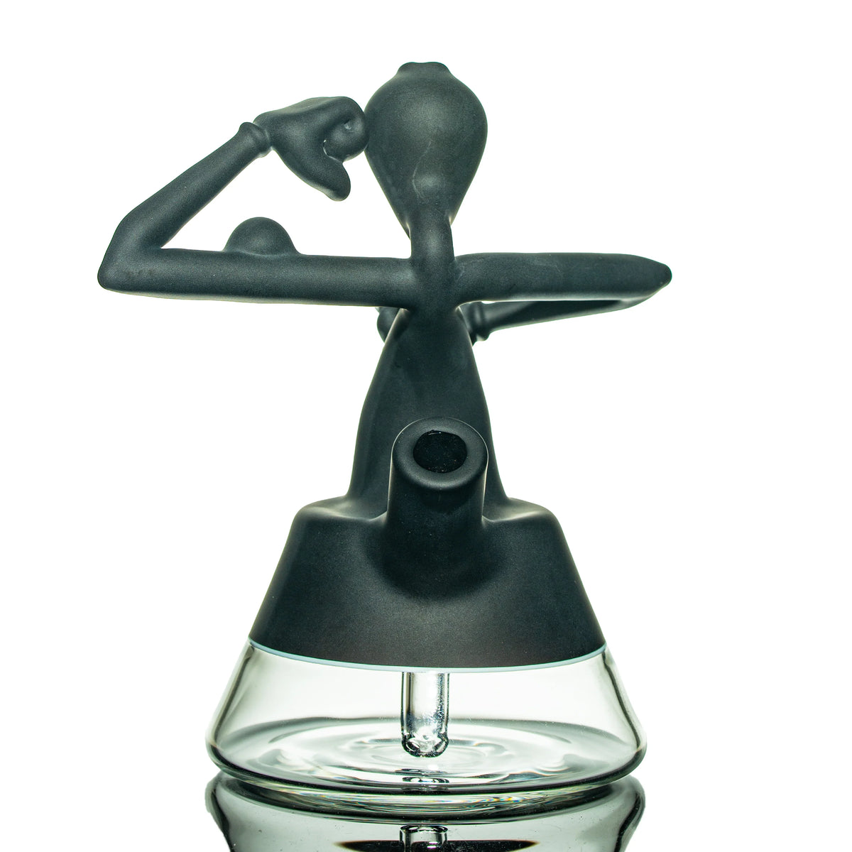 Heady glass water pipe with artistic black figure design on clear base, isolated on white