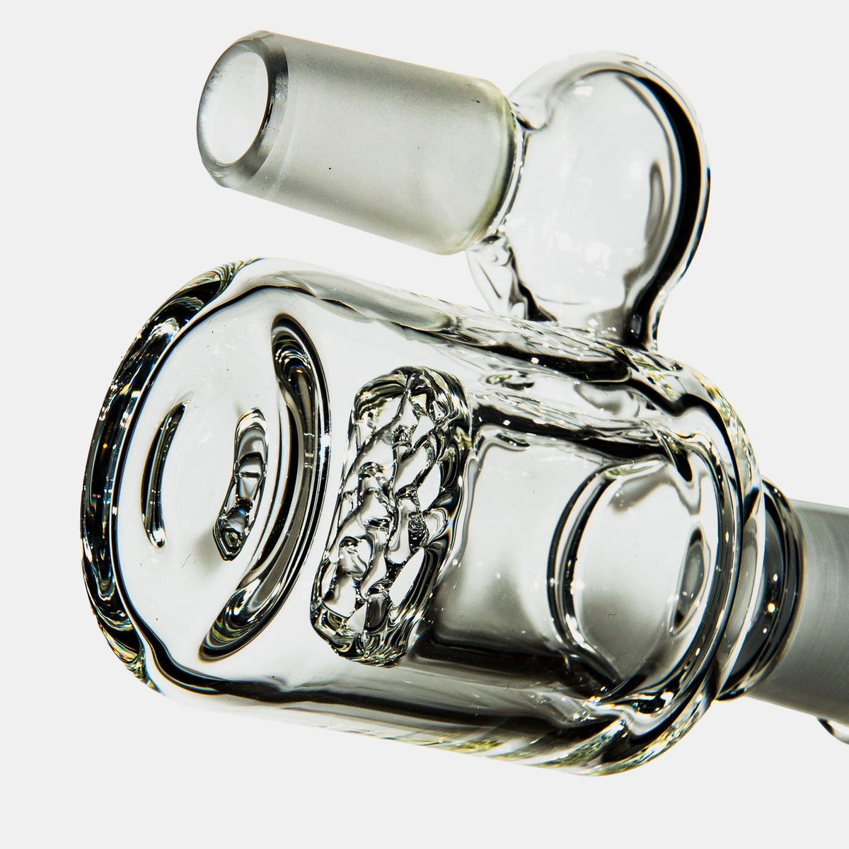 Close-up of a clear glass ash catcher accessory with percolator for water pipes