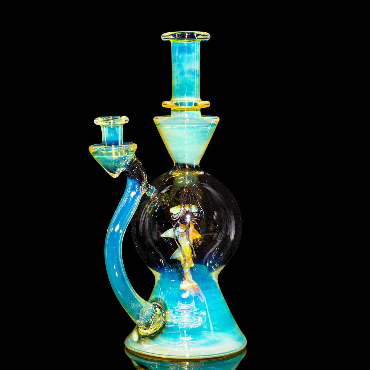 Heady glass water pipe with blue and yellow accents on a black background