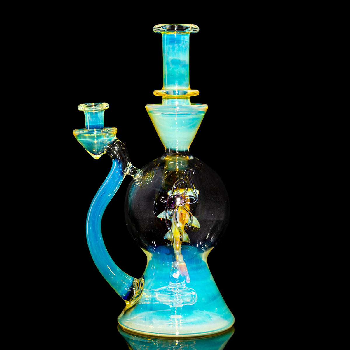 Heady glass water pipe with decorative blue and yellow accents on black background