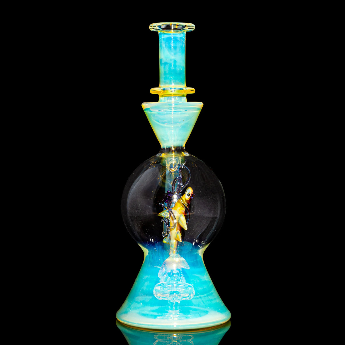 Heady glass water pipe with intricate fish design, blue and yellow accents, on black background