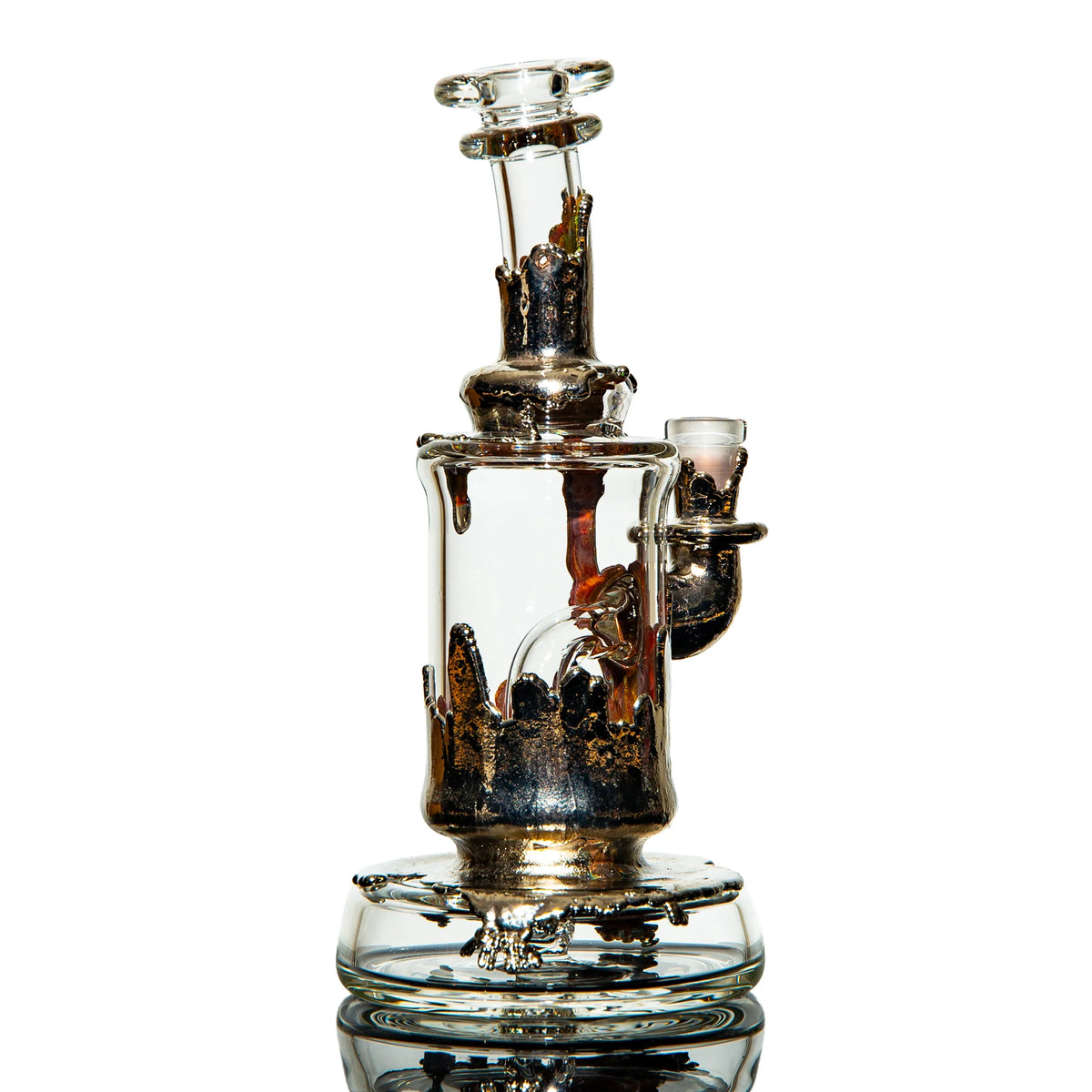 Heady glass water pipe with intricate metallic details against white background