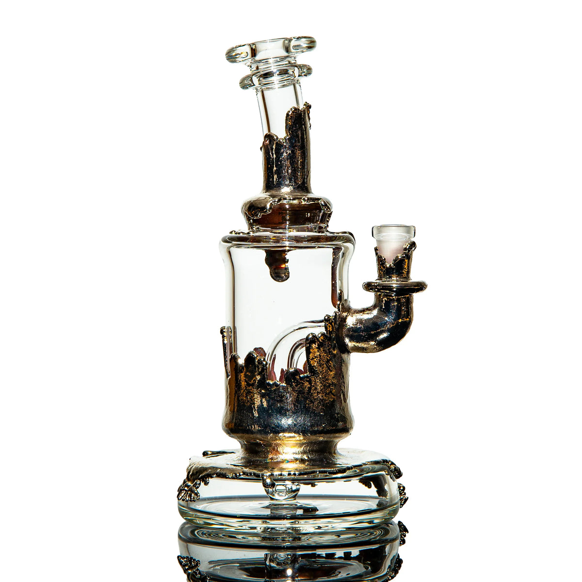 Heady glass water pipe with metallic accents, clear chamber, and artistic glasswork