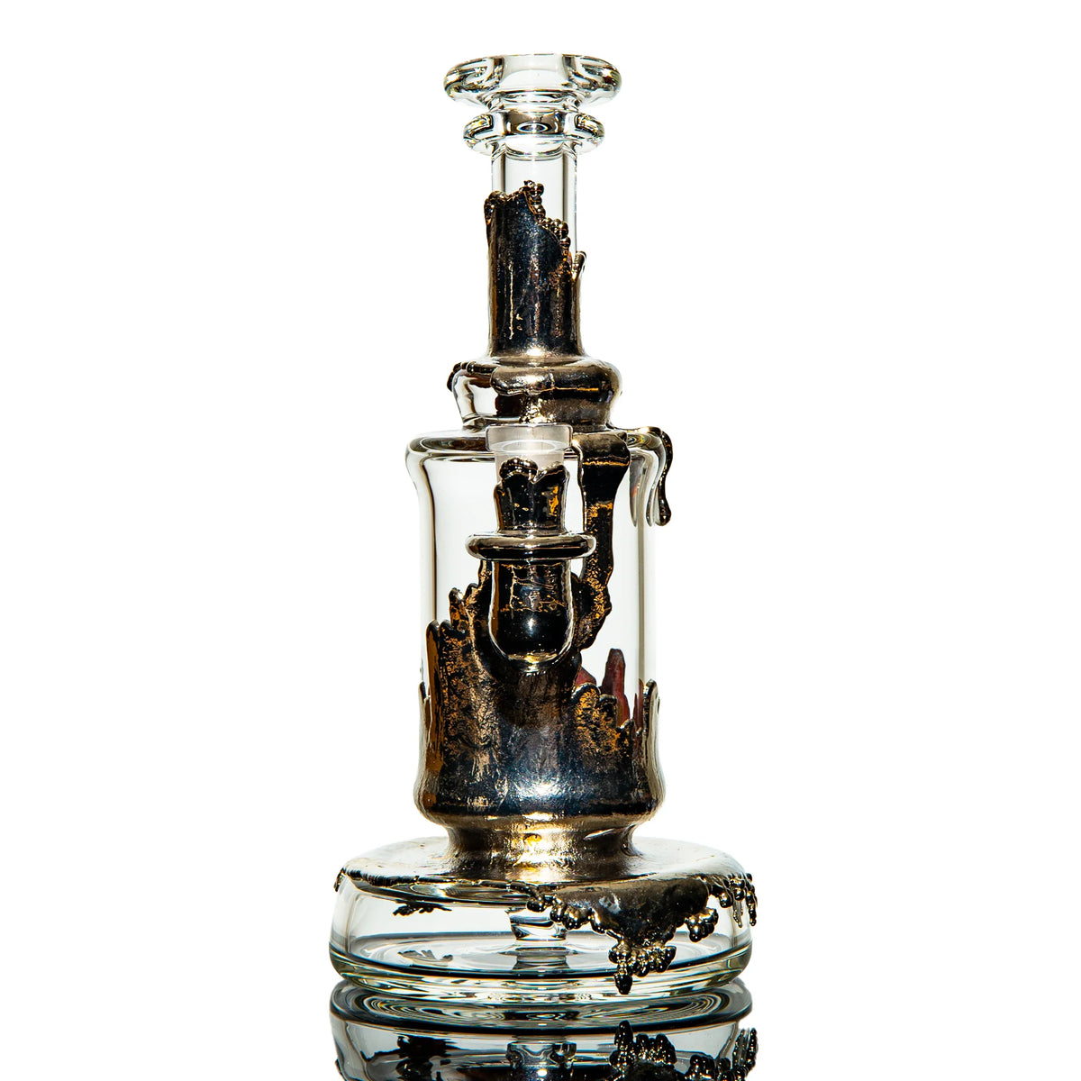 Artistic heady glass water pipe with metallic accents, isolated on white background.