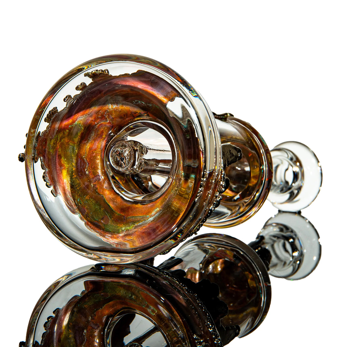 Handcrafted glass water pipe with iridescent details on reflective surface