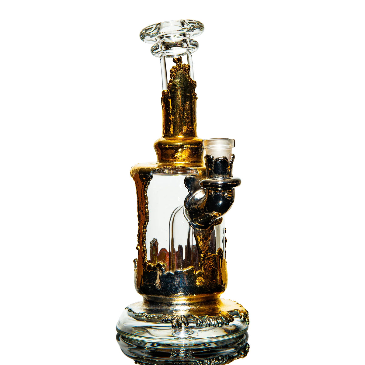 Heady glass water pipe with gold accents and intricate detailing, isolated on white background.