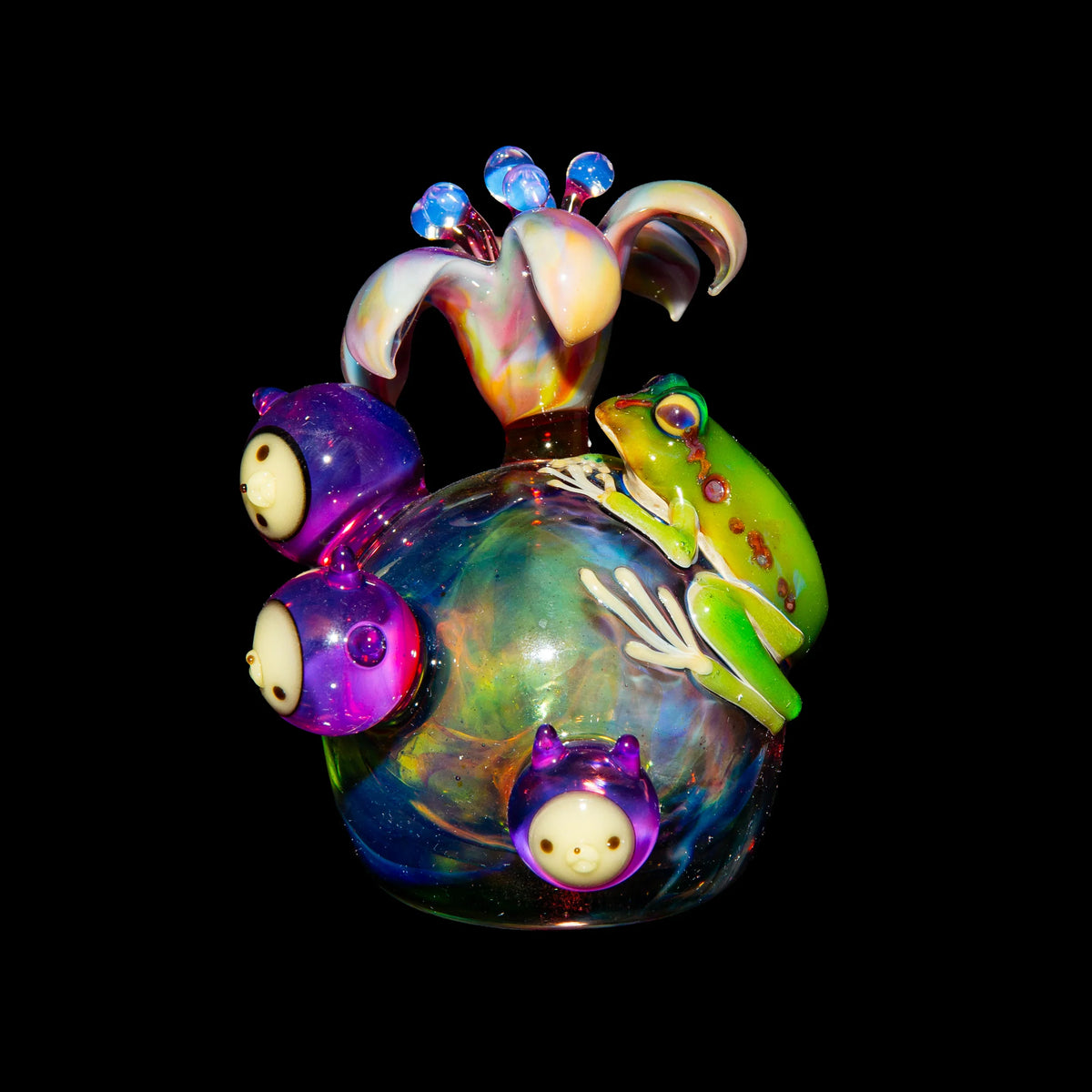 Colorful heady glass art piece with flower top, cartoon faces, and a green frog detail
