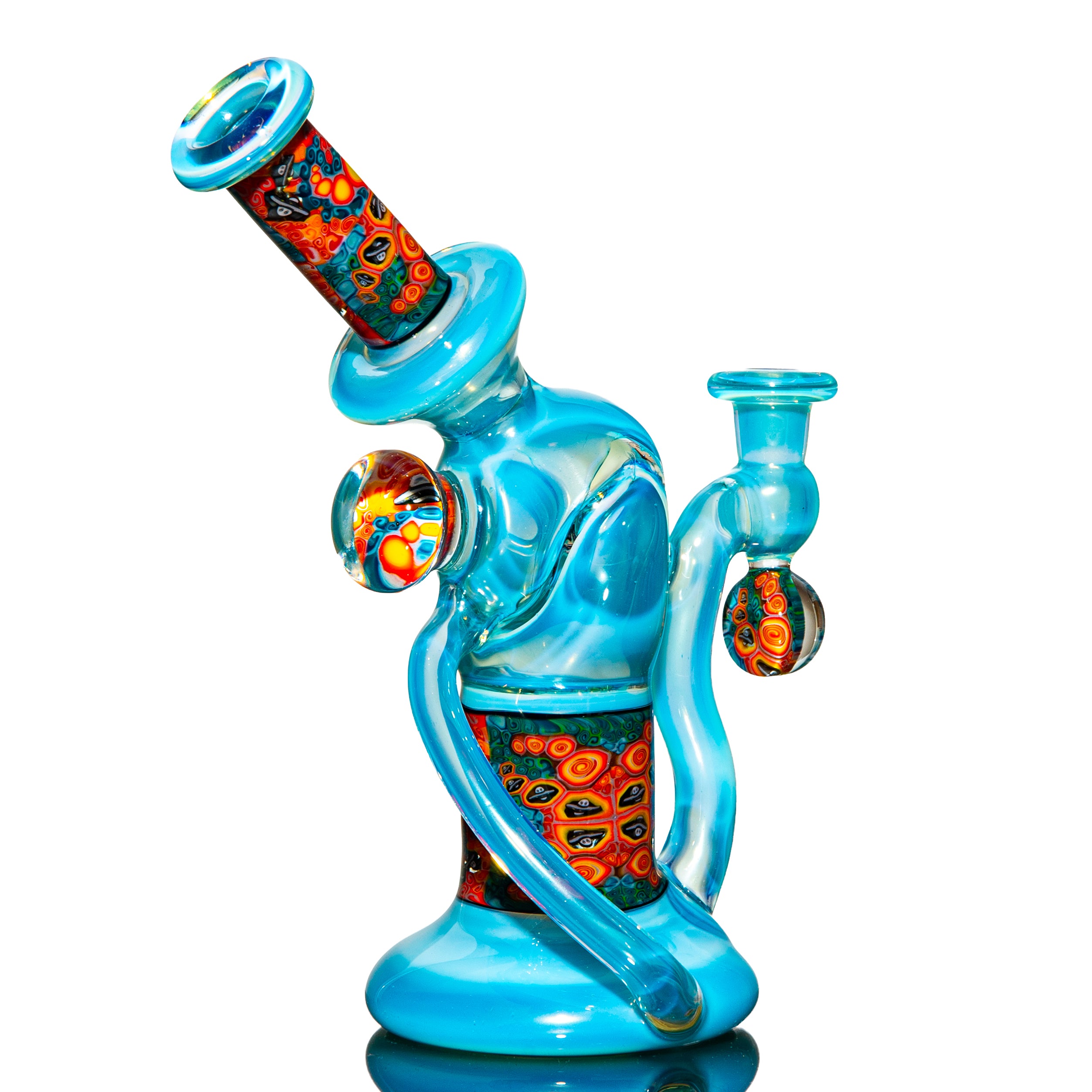 Blue heady glass water pipe with colorful millefiori details on a white background