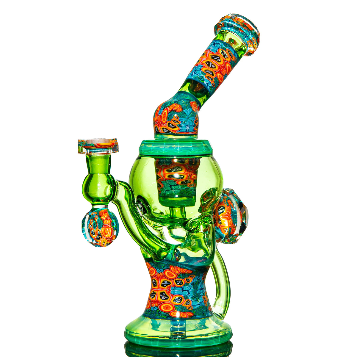 Colorful green and orange heady glass water pipe with intricate patterns, isolated on white