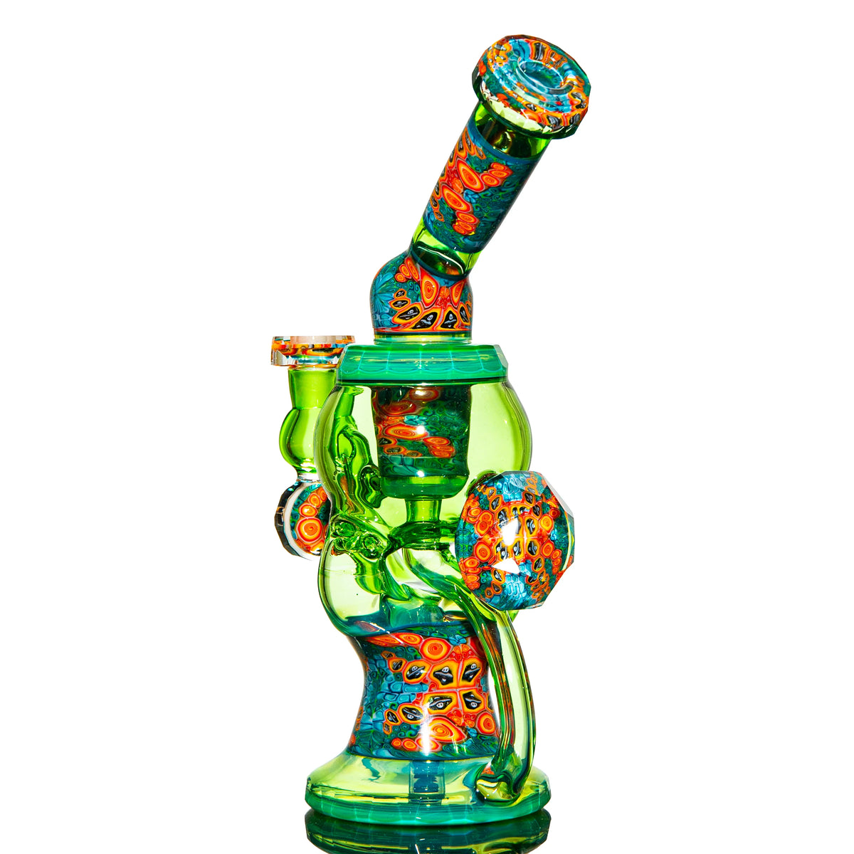 Heady glass water pipe with vibrant green and colorful patterned accents, isolated on white.