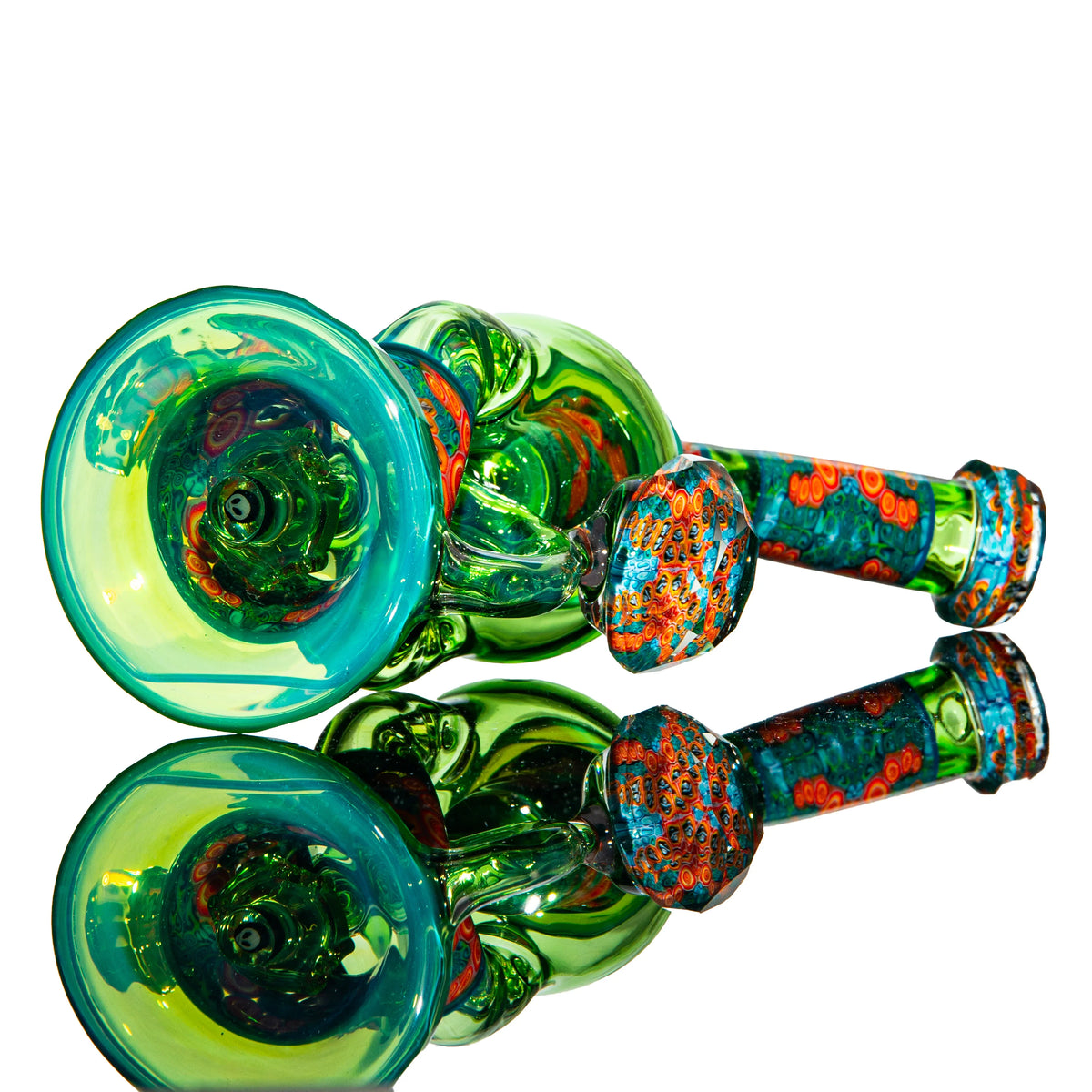 Colorful glass hand pipe with green, blue, and orange intricate designs on white background
