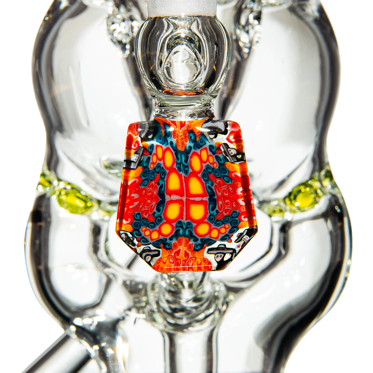 Close-up of heady glass water pipe with vibrant red, yellow, and blue decorative accent