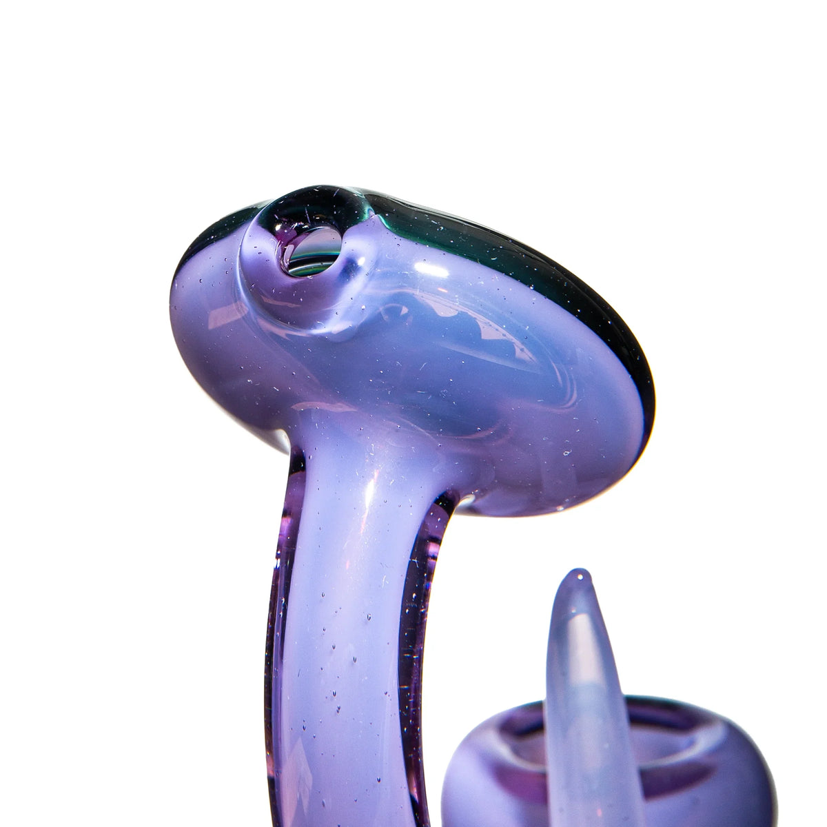Close-up of a purple glass hand pipe with artistic design on white background