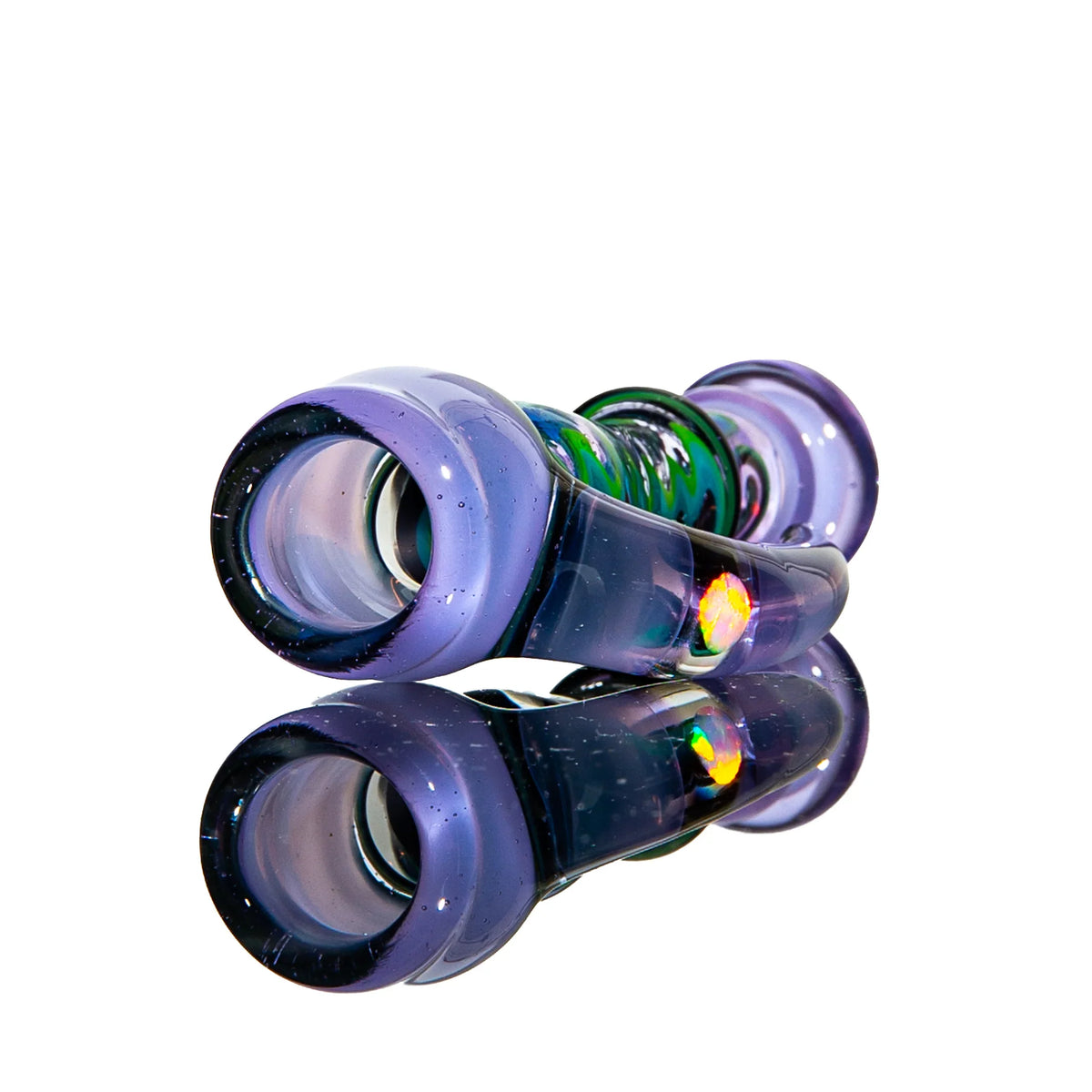 Colorful hand-blown glass pipe with opal inlay, displayed on reflective surface
