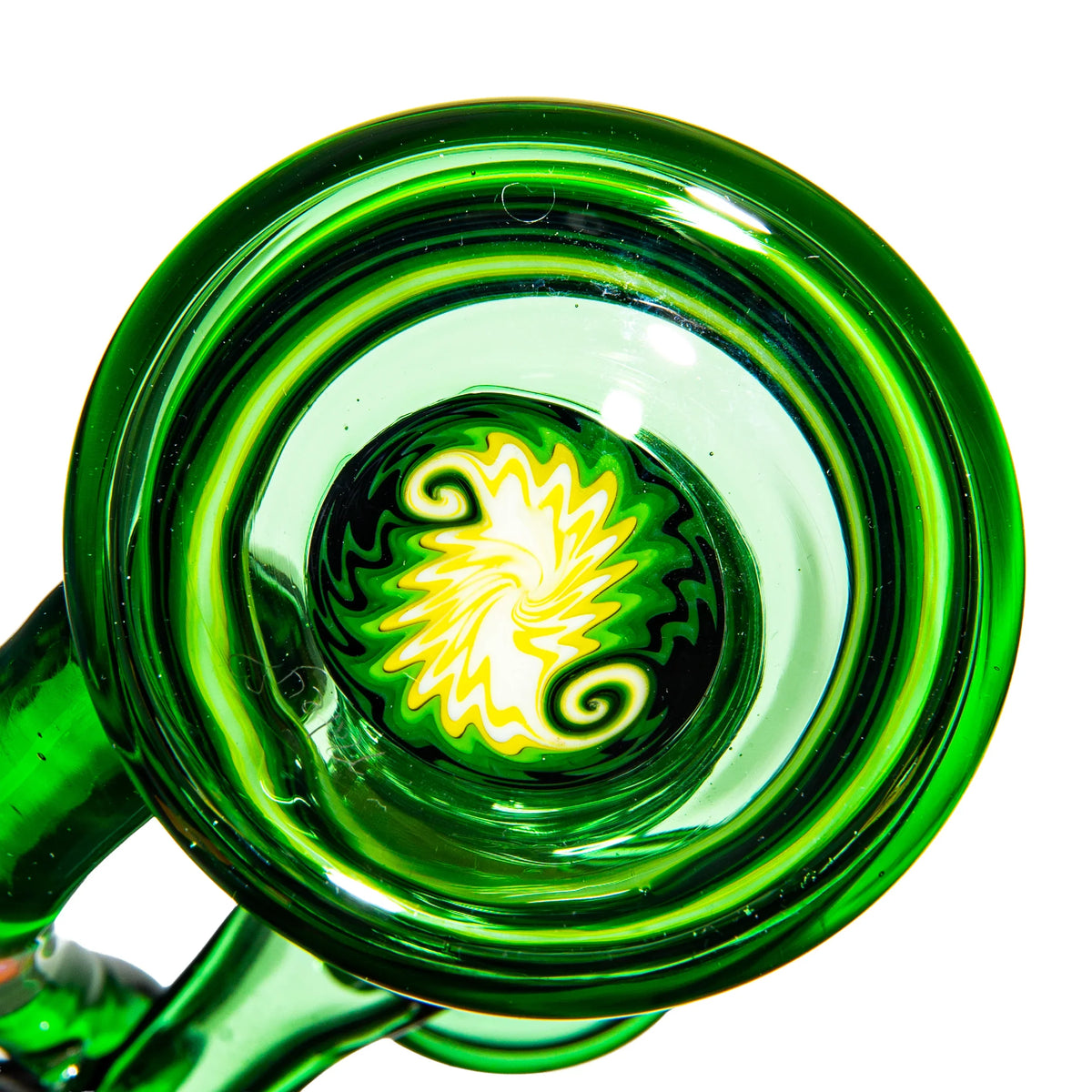 Green and yellow heady glass pipe with intricate swirl design, photographed from above