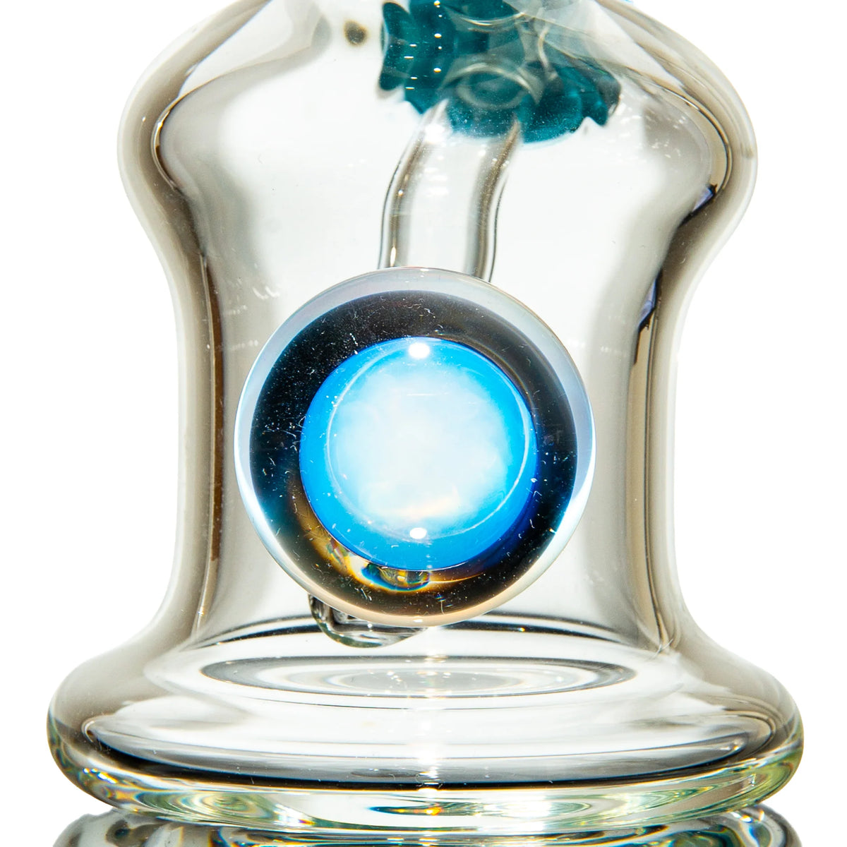 Close-up of artisan glass water pipe with a blue decorative marble accent