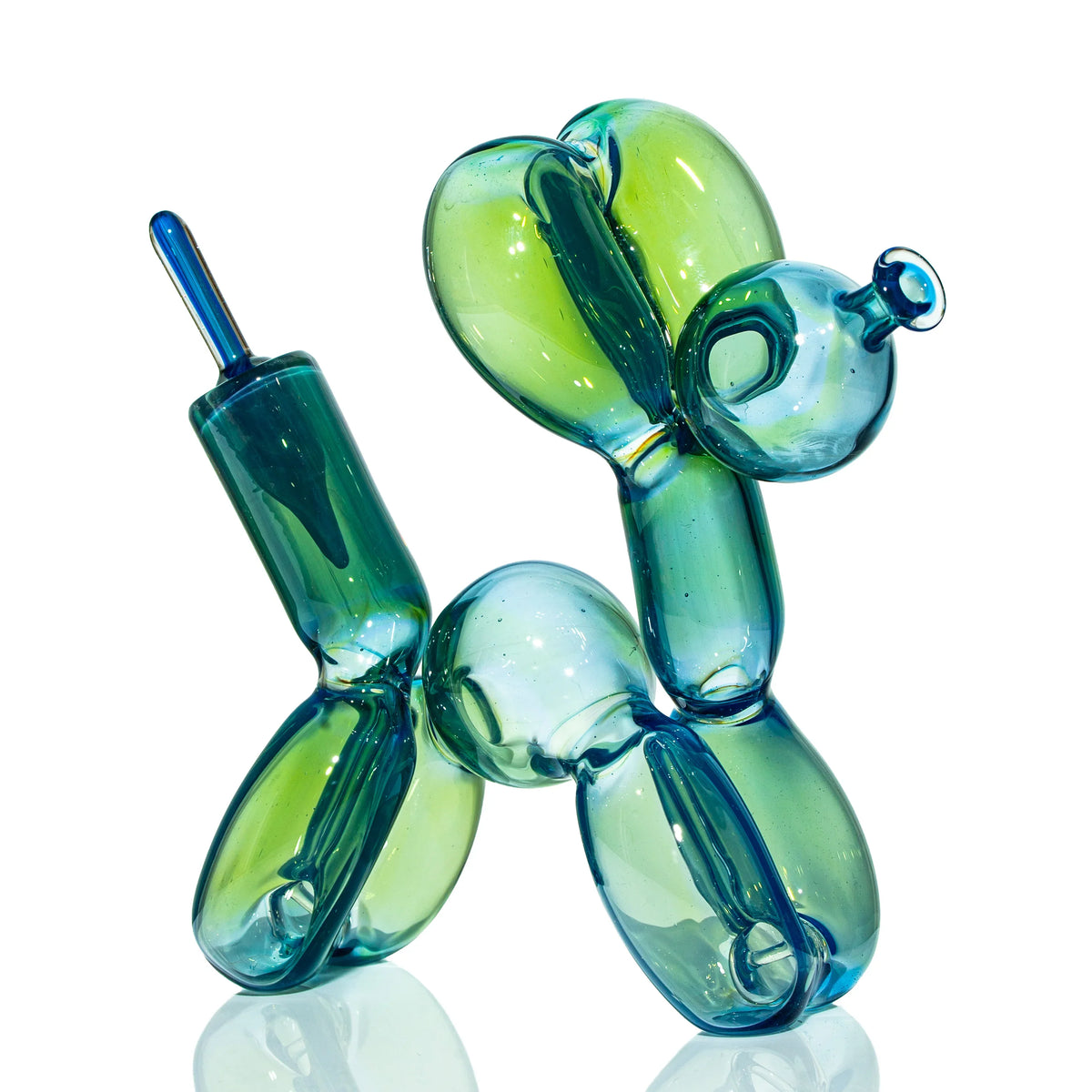 Colorful glass piece shaped like a balloon dog, heady glass art on white background