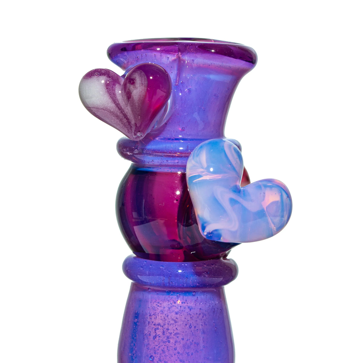 Purple glass pipe with decorative heart accents and swirled color details