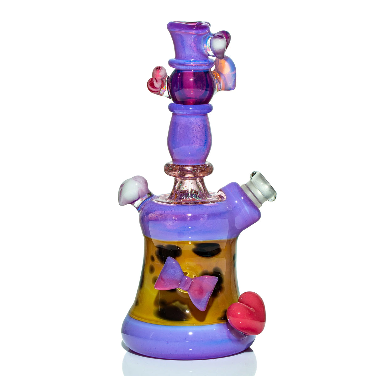 Colorful heady glass water pipe with purple and yellow accents, heart and bow details