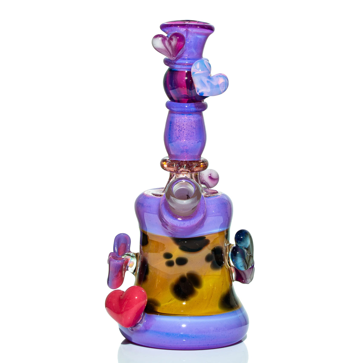 Colorful glass water pipe with purple and yellow hues, heart accents, and artistic design.