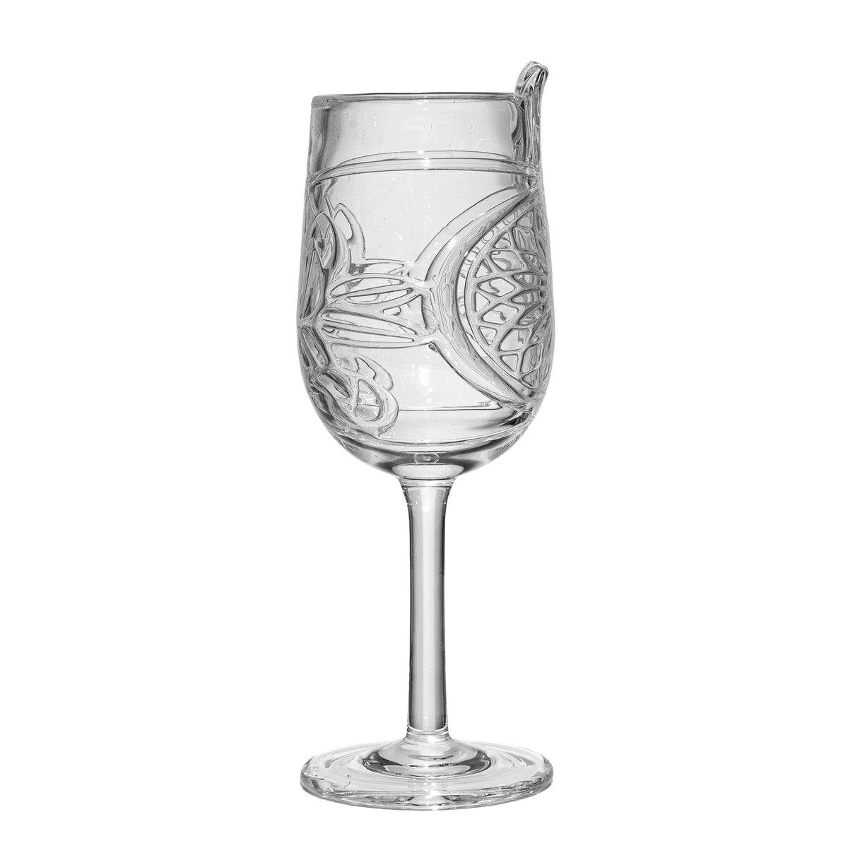 Clear etched glass goblet with intricate designs on a white background