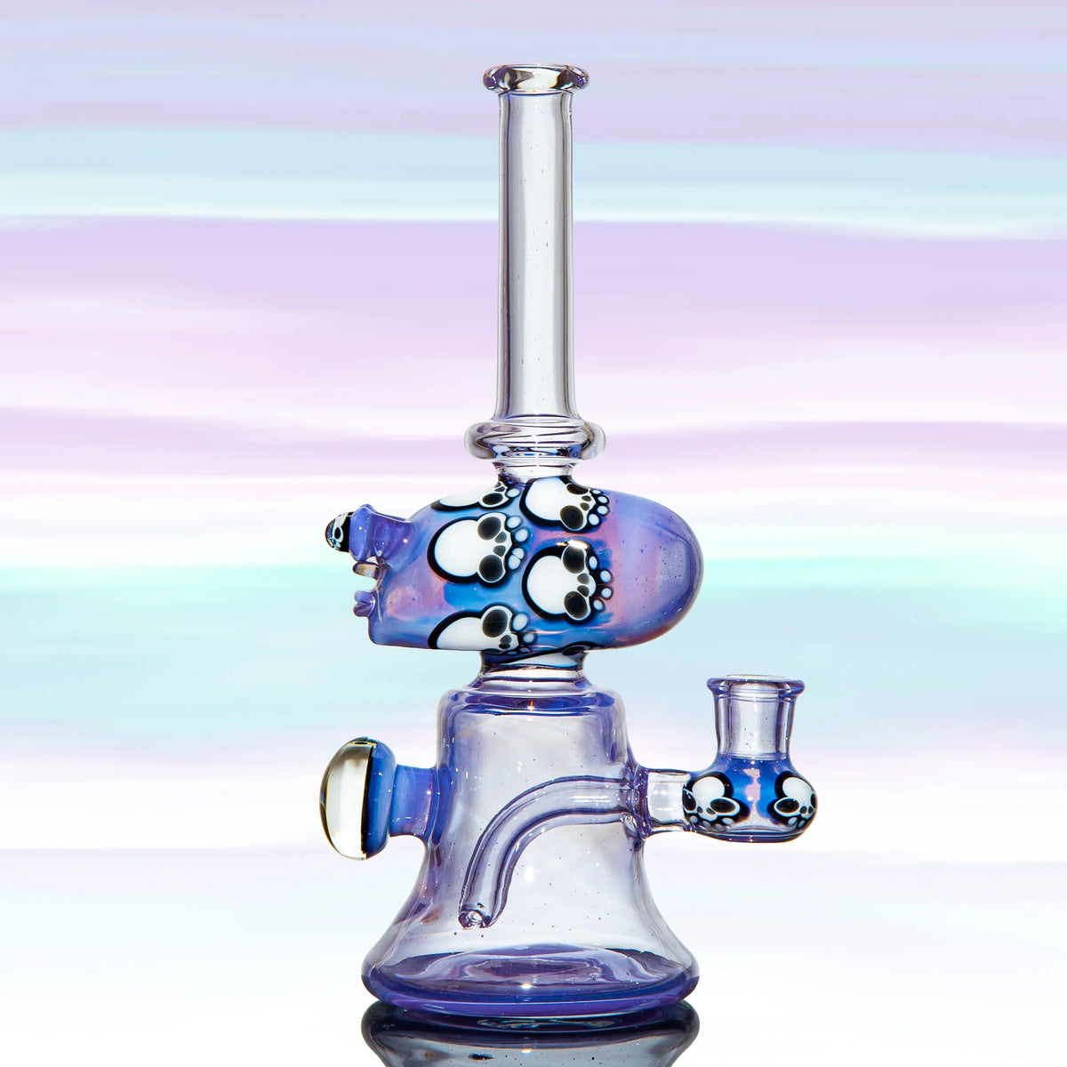 Purple glass water pipe with artistic bear paw prints, heady glass, on pastel background
