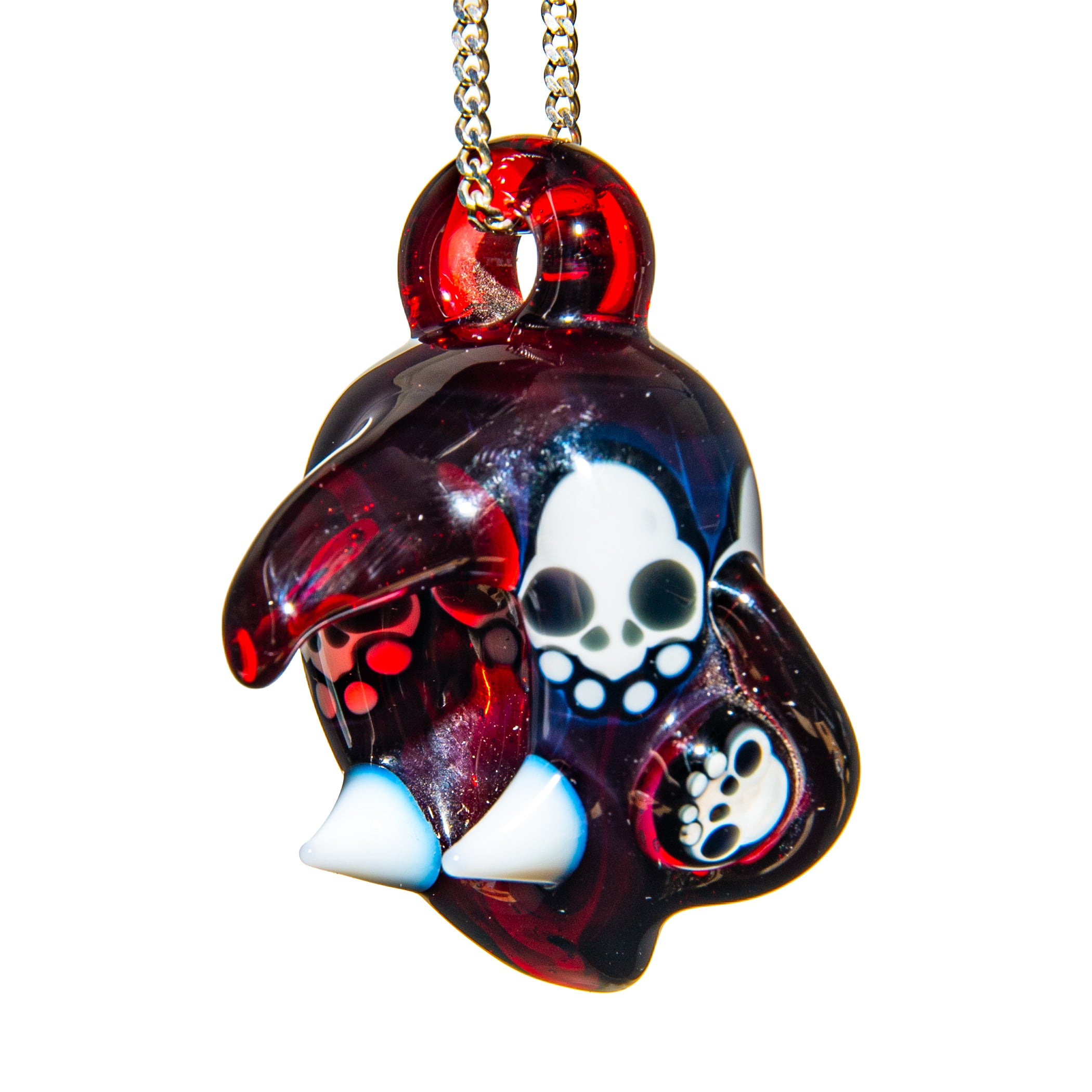 Handcrafted glass pendant with skull and bear paw designs, red and blue accents on chain
