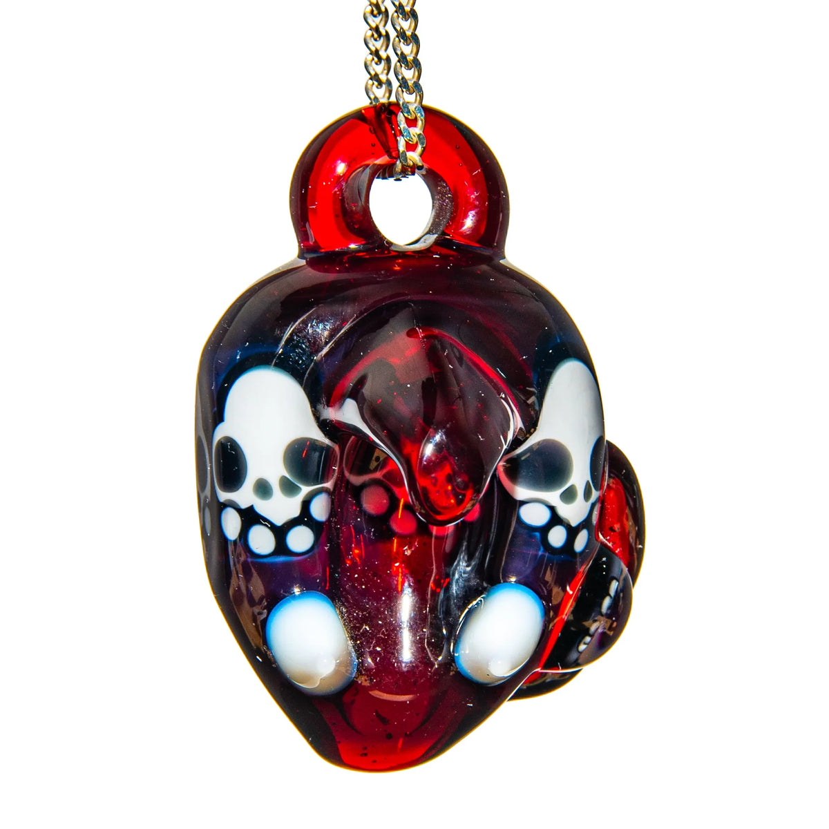 Handcrafted red glass pendant with white skull designs on a metal chain