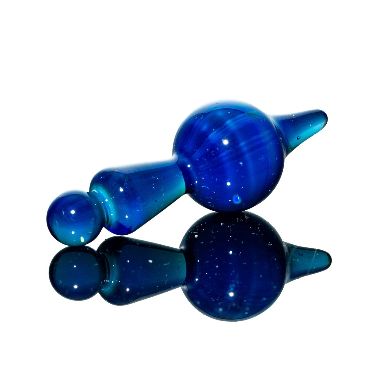 Blue glass carb cap with rounded and pointed ends, displayed on reflective surface