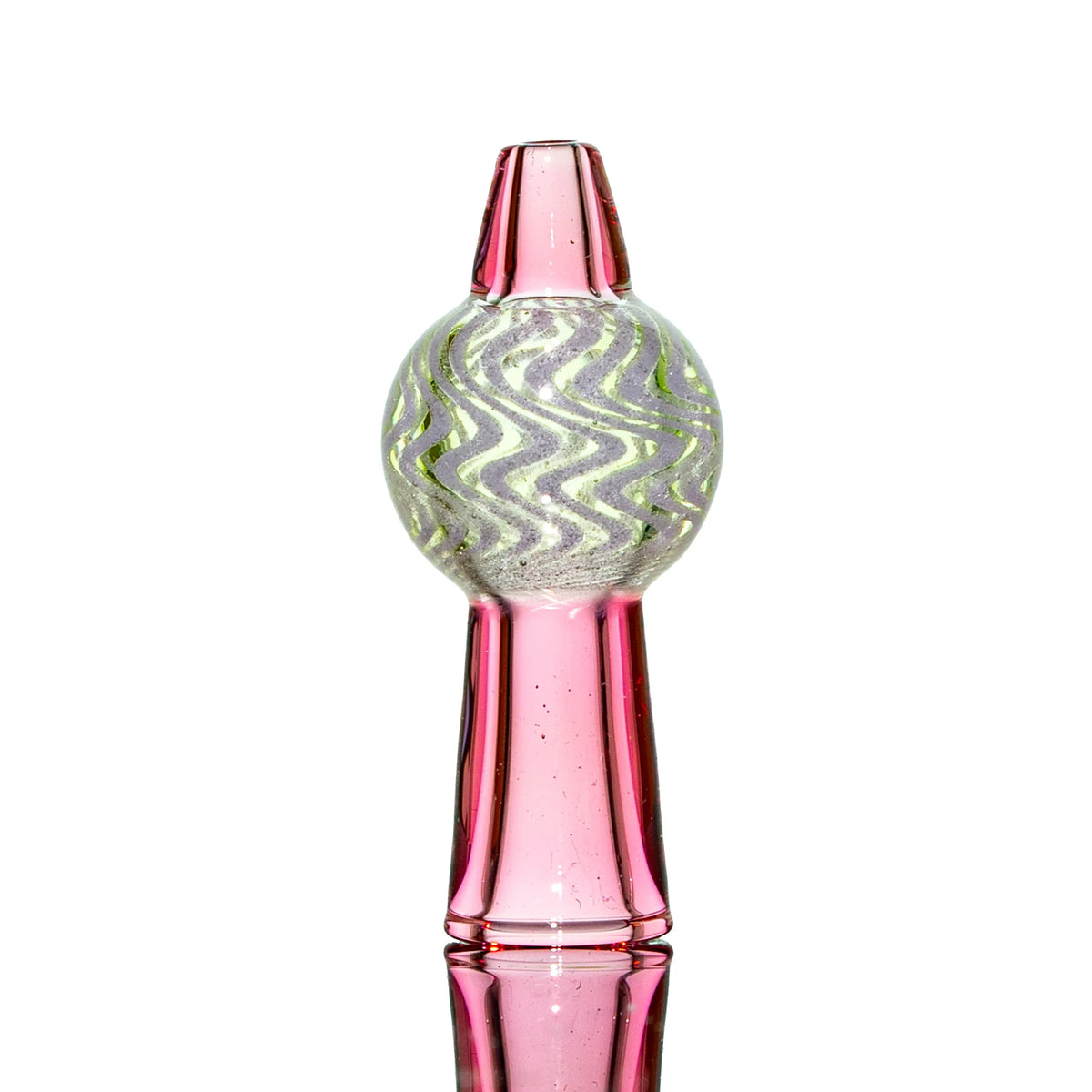 Pink glass carb cap with wavy green and white pattern, standing upright on white background.