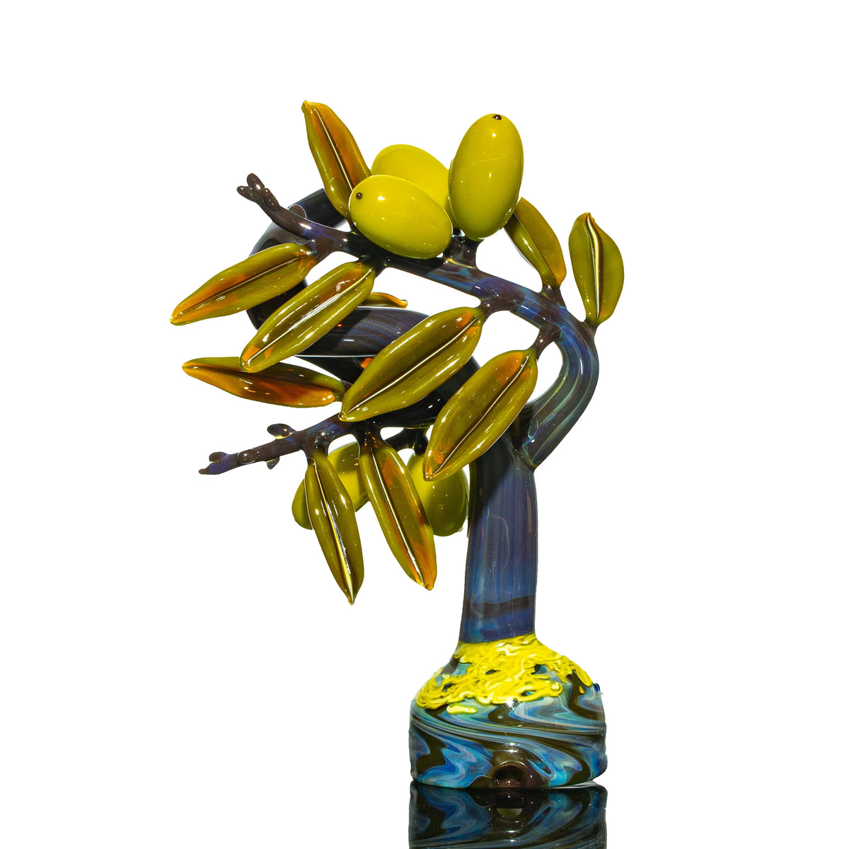 Hand-blown glass piece with a tree design by Charisma Glass