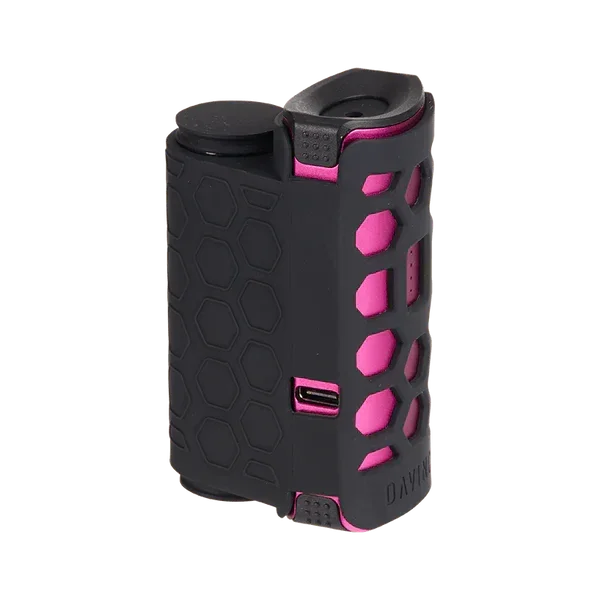 Black and pink portable vaporizer with hexagonal grip design and USB charging port