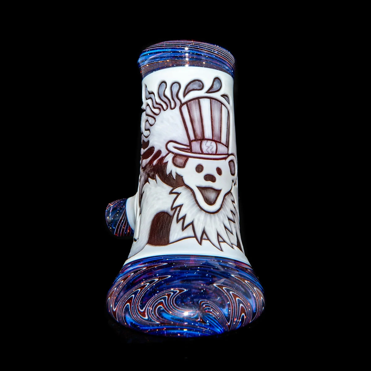 Heady glass water pipe with colorful swirls and a bear design on a black background