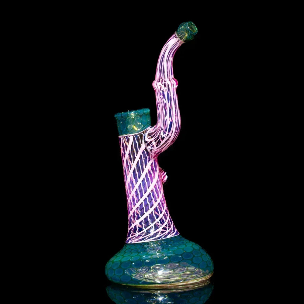 Colorful honeycomb glass bubbler with seashell pattern on a black background
