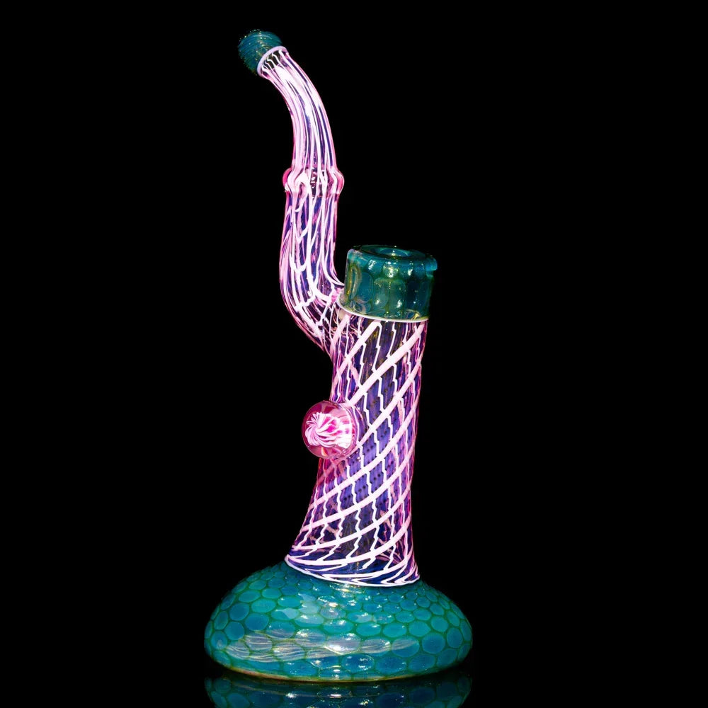 Colorful glass bubbler with honeycomb base and twisted spiral design on black background