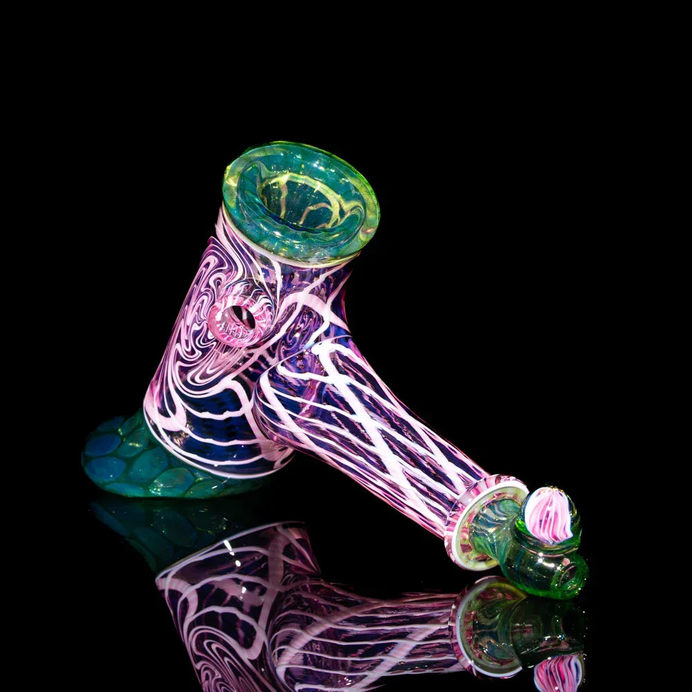 Heady glass pipe with pink, purple, and green twisted seashell and honeycomb design