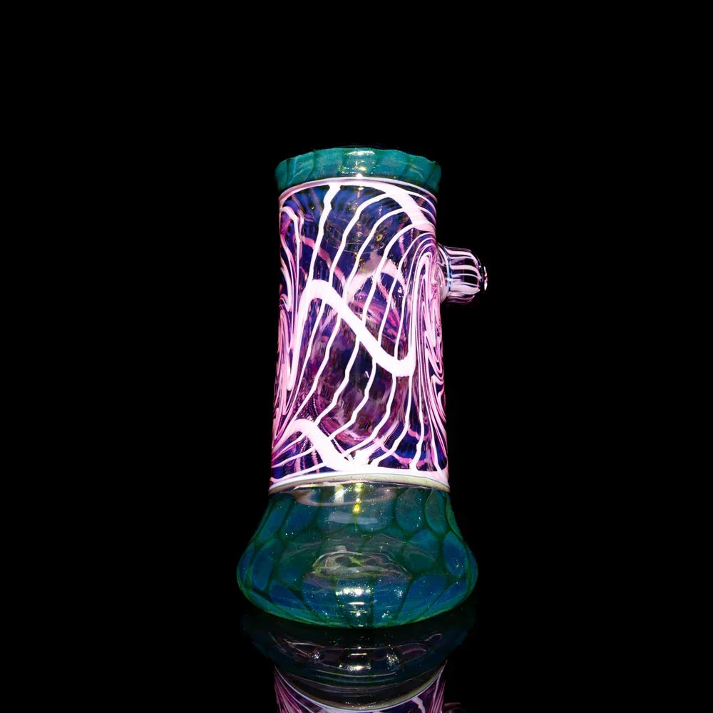 Colorful glass water pipe with intricate twisted seashell and honeycomb design on black background