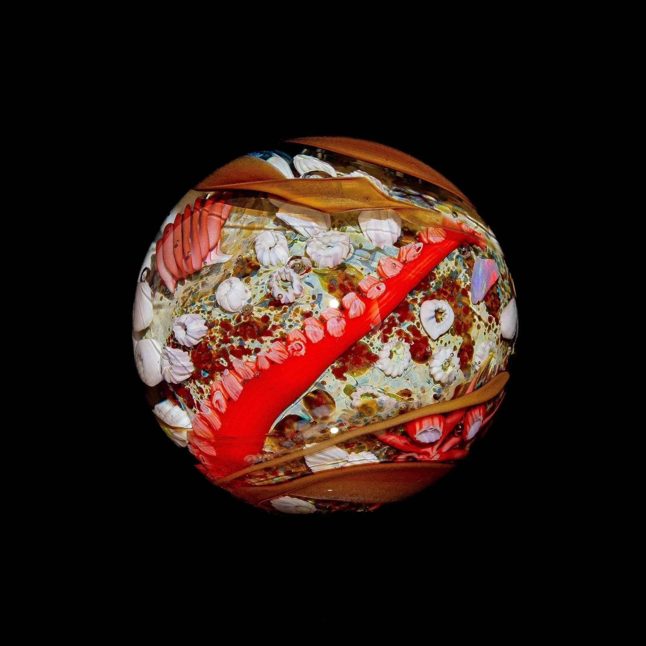 Handcrafted glass marble with red octopus tentacle and ocean-inspired details