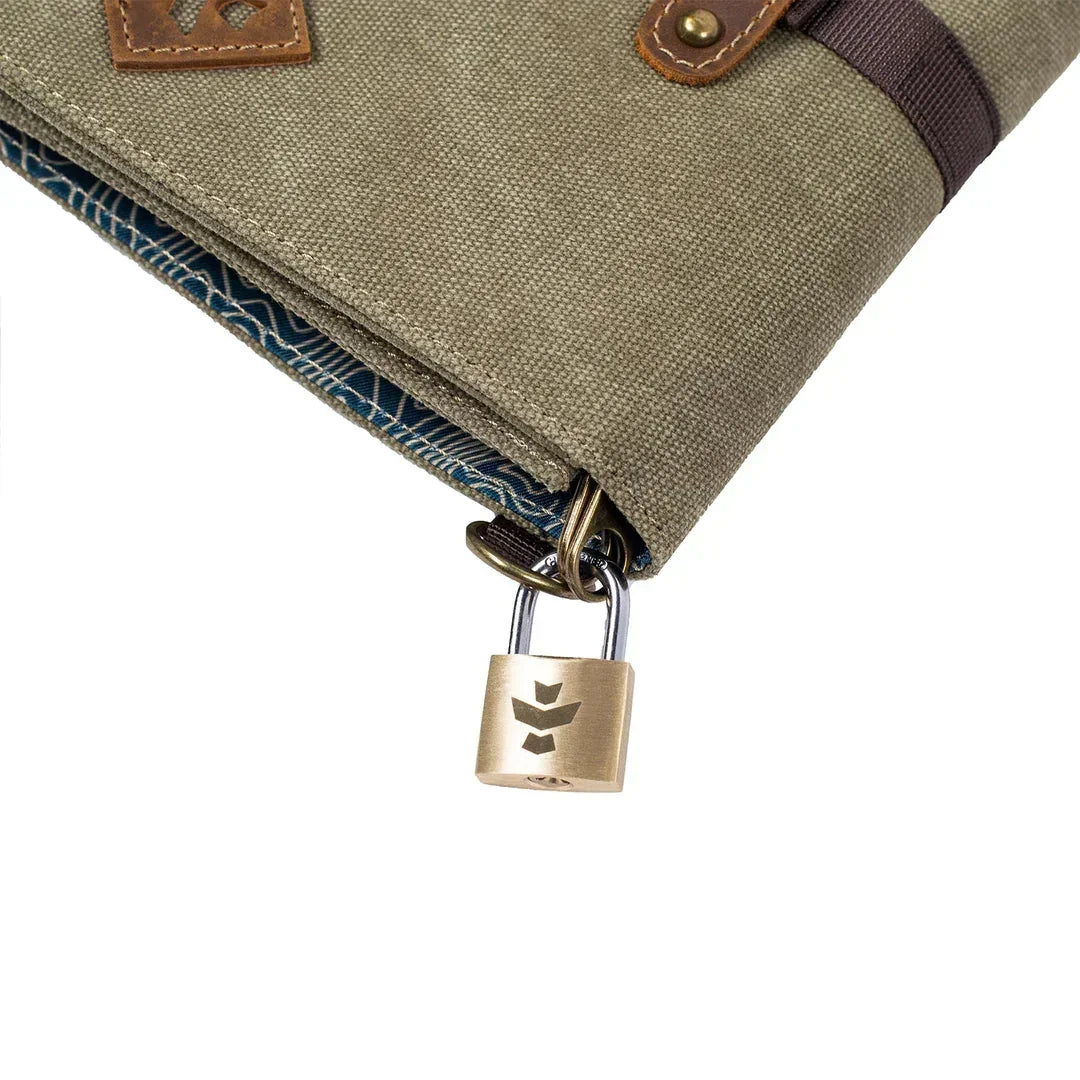 Close-up of khaki fabric stash bag with brass security padlock and patterned interior