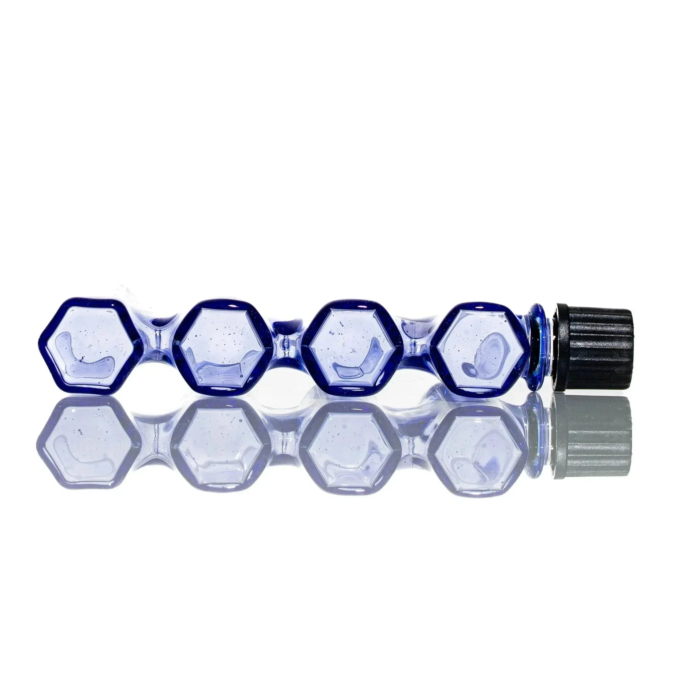 Hexagonal blue glass smoking pipe with black mouthpiece on reflective surface