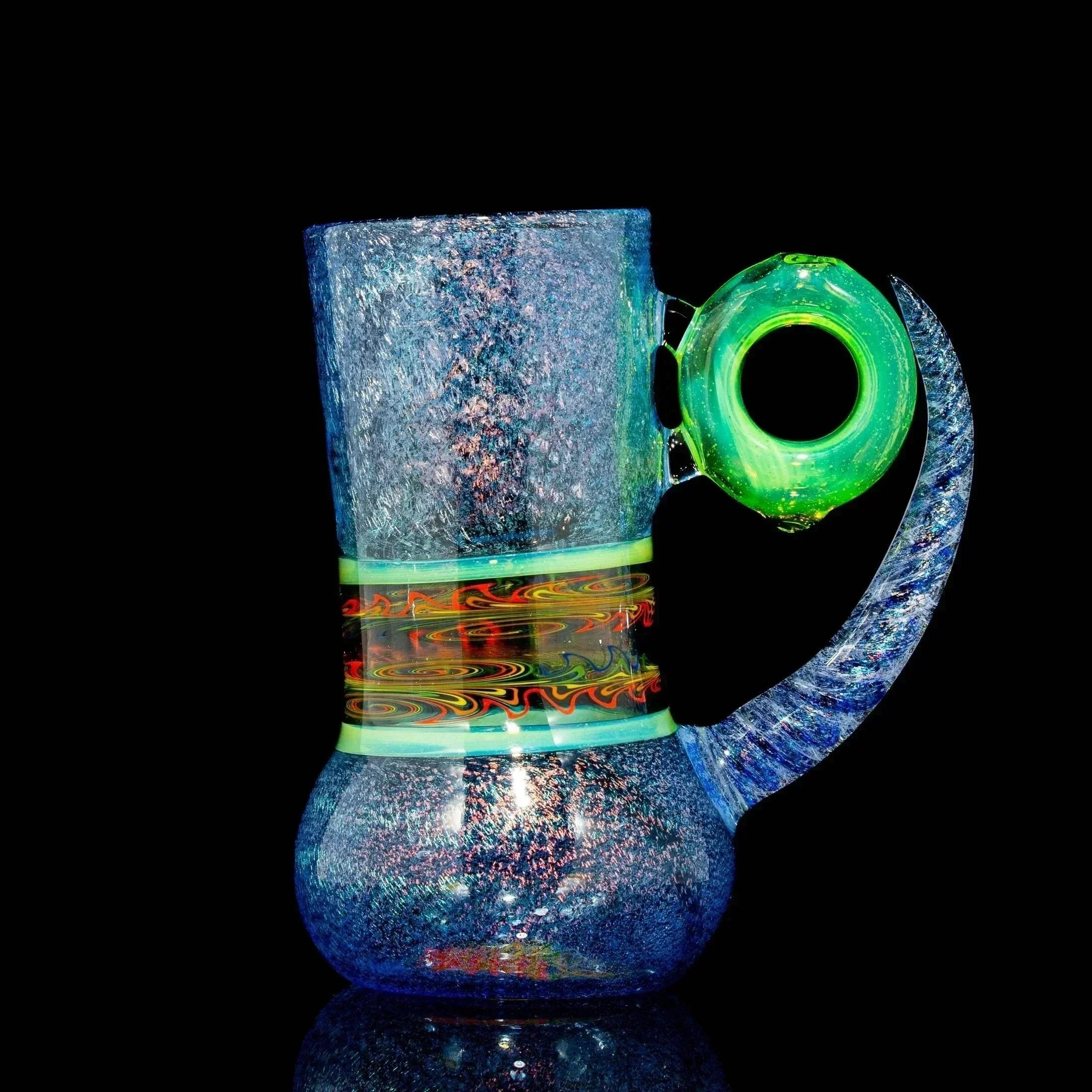 Handcrafted blue glass mug with a vibrant swirling pattern and a neon green handle