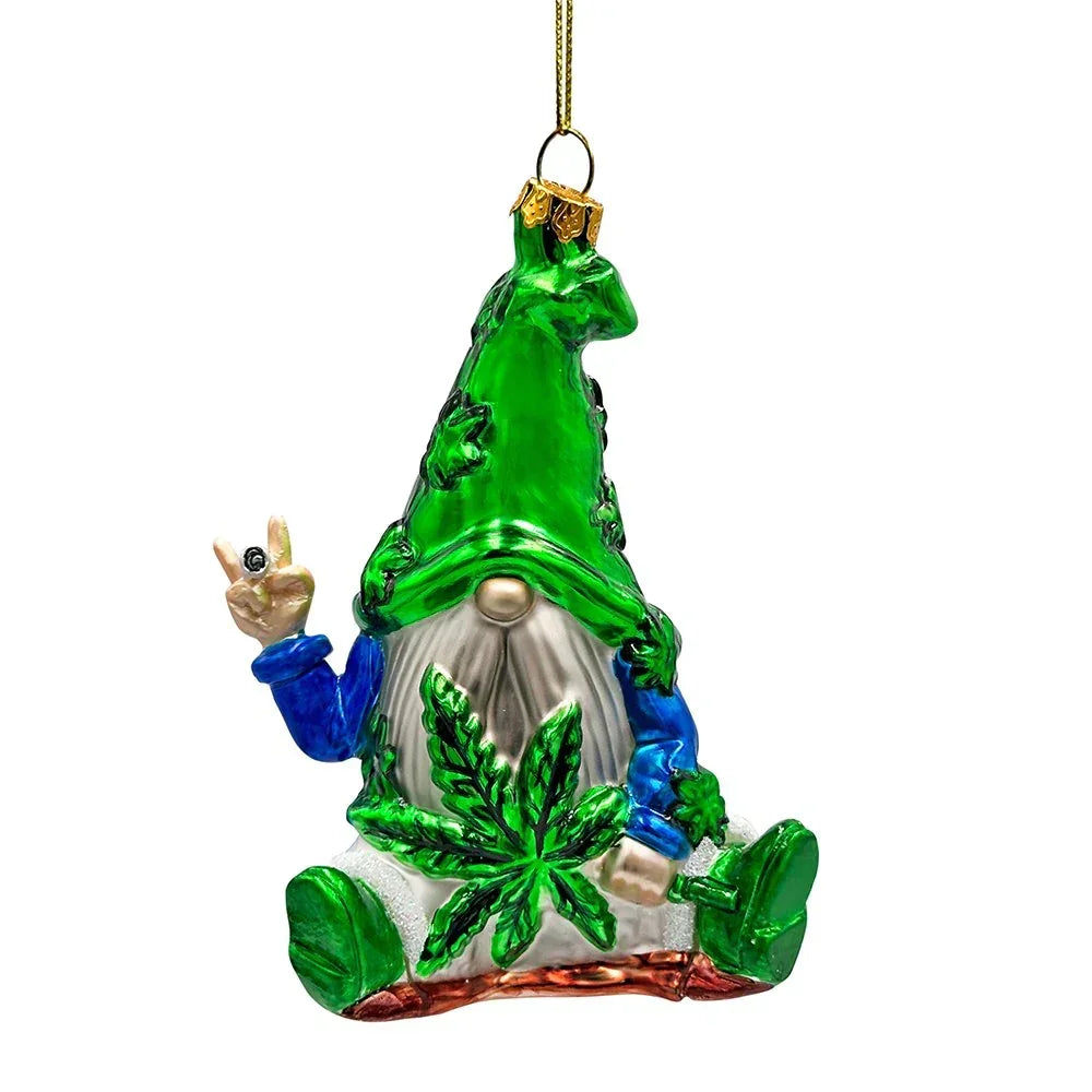 Glass gnome ornament with green leaf-themed hat and large leaf on body, holding pipe