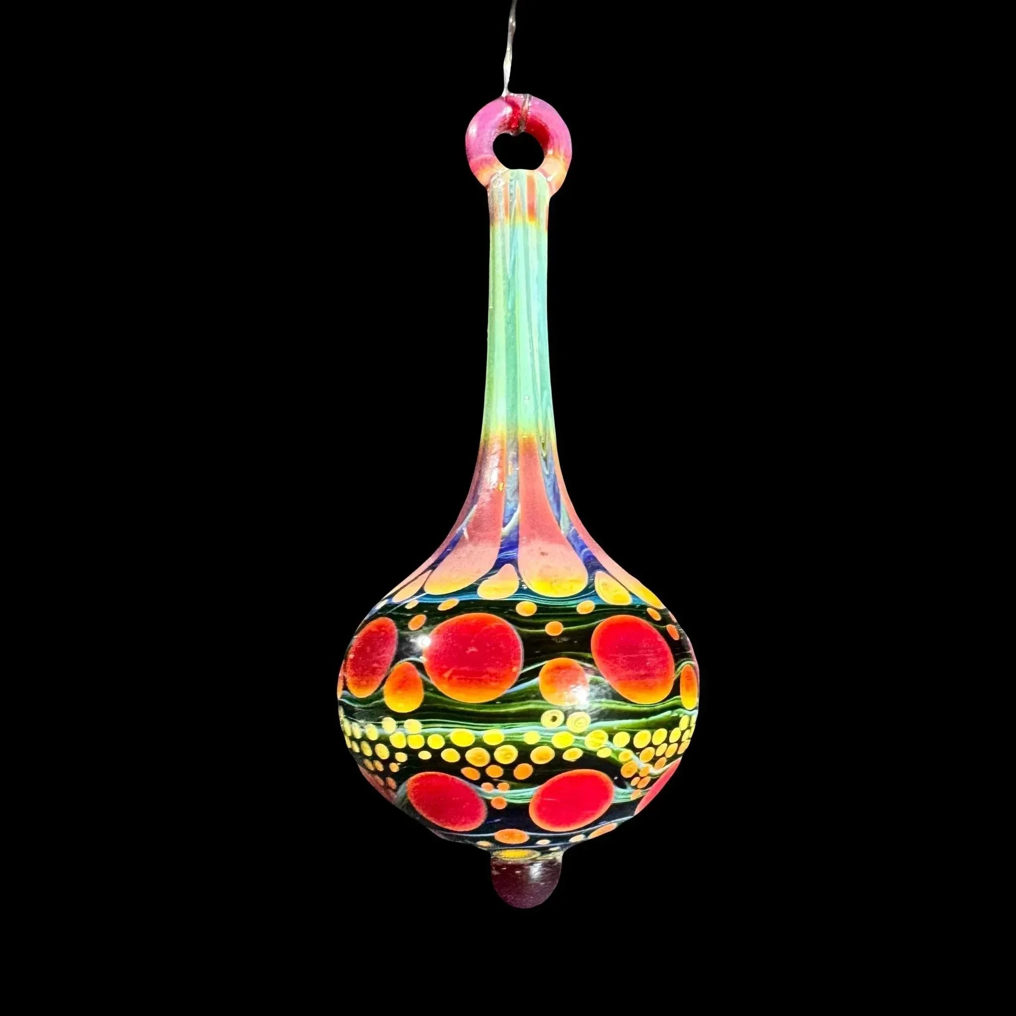 Colorful hand-blown glass pendant with red, orange, and yellow dot pattern on black background