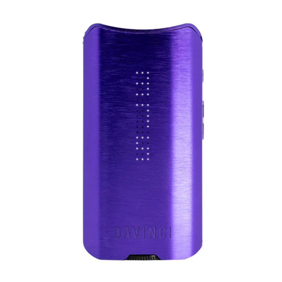 Purple portable vaporizer device with LED display and sleek metallic finish