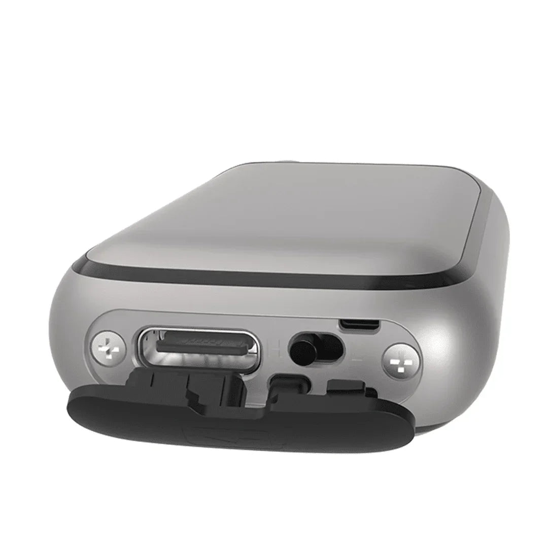 Close-up of silver vaporizer device charging port and controls