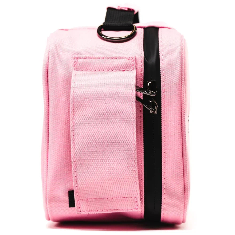 Side view of a pink canvas carrying case with black zipper and metal ring