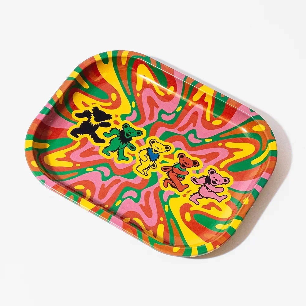 Colorful psychedelic rolling tray with dancing cartoon bears on a yellow, green, and pink swirl background.