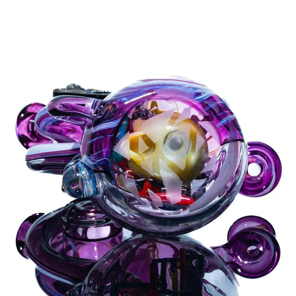 Colorful heady glass pipe with vibrant purple accents and intricate inside artwork