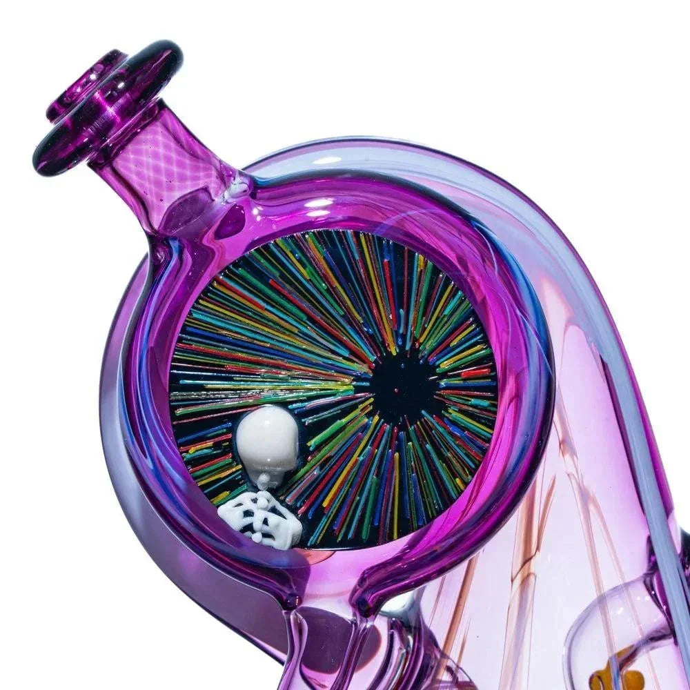 Colorful heady glass pipe with purple hues, rainbow pattern, and small white skeleton figure